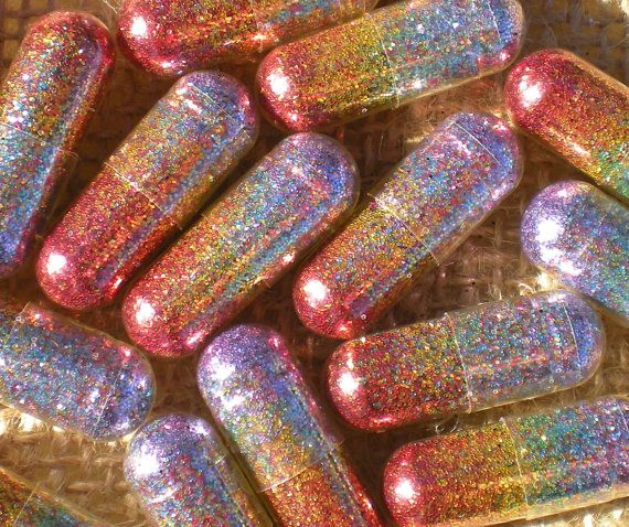 pills filled with rainbow glitter